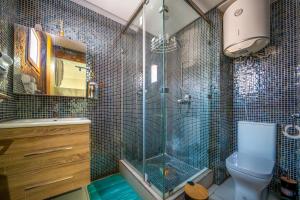 a bathroom with a glass shower and a toilet at JASMINe in Marrakesh +55 photos