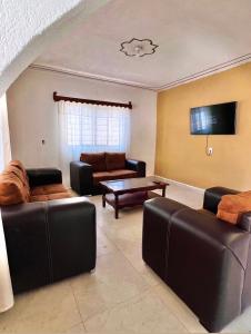 a living room with couches and a table at La prieta linda in Tamasopo