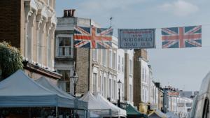 a street with a market with british flags on it at Ruby Zoe Hotel London by IHG in London