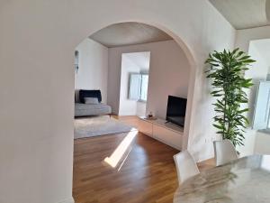 a living room with a bed and a table and chairs at Fontana Maggiore View Suite in Perugia