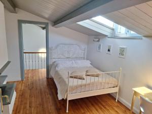 a bedroom with a bed in a room with a window at Fontana Maggiore View Suite in Perugia