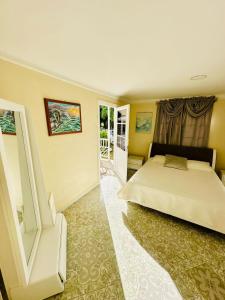 a bedroom with a large bed and a window at Enchanted Paradise in Ayacucho