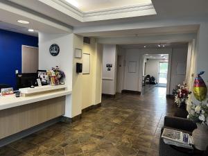a lobby of a dermatologists office with a waiting room at Super 8 by Wyndham Estevan in Estevan