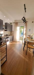 a kitchen and dining room with a table and a dining room at Casa Rodolfi, Vicenza in Vicenza