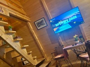 a stage in a room with a sign on the wall at Podgoricka Koliba in Mosor