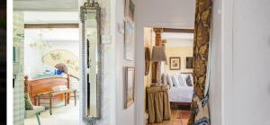 a room with a bed and a mirror at 16th Century Manor House in Richborough +78 photos