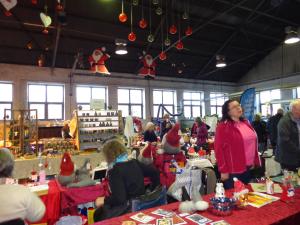 a group of people in a store with santa hats at Målerås B&B Guesthouse in Målerås