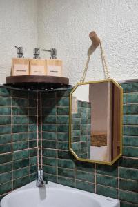 a bathroom with a mirror and a sink at Casa Elia l Beach Nook Suite l Walk to Beach&Surf in San Juan