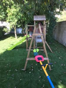 a wooden toy swing set with a ball at Marcemar in Borbén +10 photos