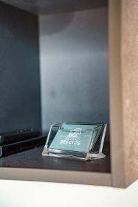 a box with a book on top of a table at Appartement Gondola & Spa - MultiPass in Les Gets