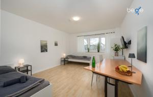 a room with a bed and a table with bananas on it at BEGE APARTMENTS ProStay in Lüdenscheid