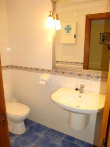 a bathroom with a sink and a toilet at Aititerena in Murueta-Orozko