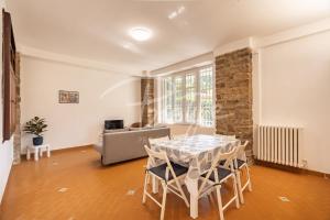 a living room with a table and a couch at A due passi dal mare in Portovenere