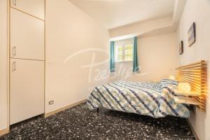 a bedroom with a bed and a window at A due passi dal mare in Portovenere