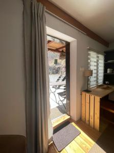 a room with a sliding glass door to a patio at Zielony Pokój in Ojców +4 photos
