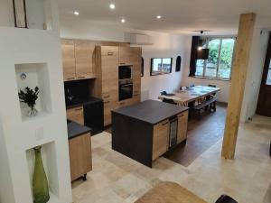 a large kitchen with a table and a dining room at La casa de Soto in Lourdes +55 photos