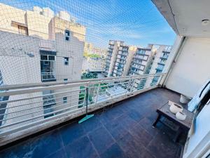 a balcony with a table and a view of a city at Pradise in Mohali
