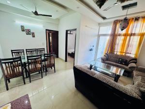 a living room with a couch and a table at Pradise in Mohali