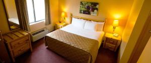 a hotel room with a bed and a window at Cranberry Country Lodge in Tomah