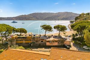 a view of a beach with houses and a boat at Villa Elena in Portovenere