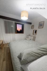 a bedroom with a bed and a window in it at Rayo Verde-Vistas al mar in Punta del Hidalgo +11 photos