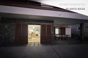 an open door of a building with a kitchen at Rayo Verde-Vistas al mar in Punta del Hidalgo