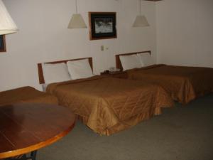 Postel nebo postele na pokoji v ubytování Georgetown Mountain Inn