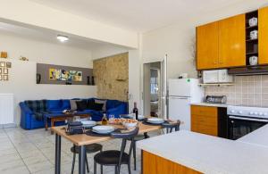 a kitchen and living room with a table and chairs at Karel house in Karés
