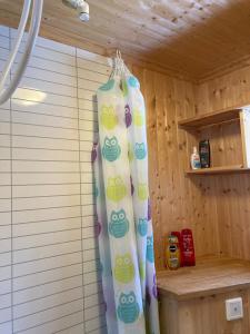 a shower curtain is hanging in a room at Cabin in Tydal, enjoy! in Tydal +18 photos