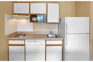 a kitchen with a white refrigerator and a sink at Studio 6 Extended Stay Fishkill Route 9 NY in Fishkill