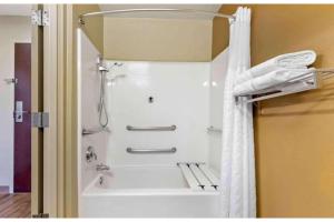 a shower in a bathroom with a shower curtain at Studio 6 Extended Stay Fishkill Route 9 NY in Fishkill +24 photos