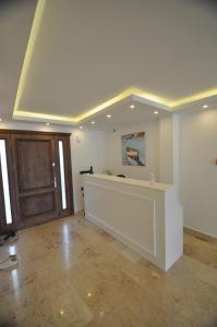 an empty room with a counter and a door at Villa Port Bodrum in Bodrum City +61 photos
