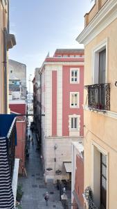 a view of an alley between two buildings at Cielo Cagliari For2 Design - Comfort Solo Adulti in Cagliari