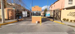 an entrance to a gate in a street at Depto 2 Planta alta, tranquilo in Zaragoza