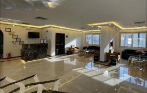 a large living room with a couch and a television at فندق روفان in Medina