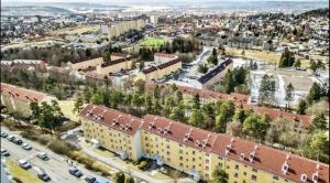 an aerial view of a city with buildings and cars at Apartment with a view at Tonsenhagen in Oslo