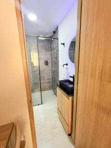 a bathroom with a shower and a sink and a toilet at Loft 4 Bambú in Laureles Stadium in Medellín +17 photos