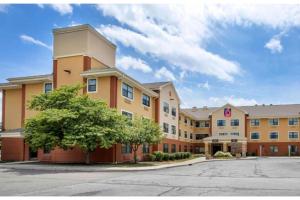 a rendering of a hotel with a parking lot at Studio 6 Extended Stay Fishkill Westage Center NY in Fishkill