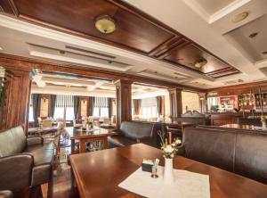 a train room with leather chairs and a table at Fiammanti Hotel Montenegro in Herceg-Novi +30 photos