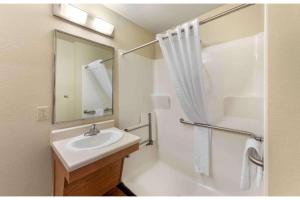 a bathroom with a sink and a shower at Studio 6 Extended Stay Birmingham Pelham AL in Pelham