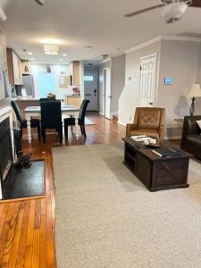 a living room with a couch and a table at Downtown house w on-site parking walk to museums, US Capital Scap in Washington, D.C.