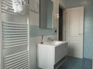 a white bathroom with a sink and a shower at La Maison du Coeur in Bari +48 photos