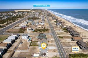 an aerial view of a beach with houses and the ocean at 6151 - Once Upon a Tide in Nags Head +94 photos
