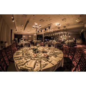 a banquet hall with a long table with glasses at Howard Johnson Hotel & Casino in Formosa +48 photos