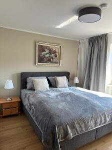 a bedroom with a large bed with two pillows at Ferienwohnung Bergidyll in Schönau am Königssee