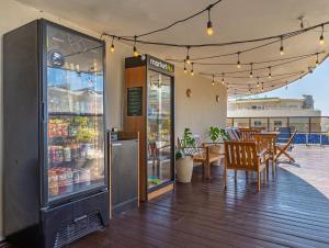 a restaurant with tables and chairs on a patio at B&B HOTEL Rio Copacabana Forte in Rio de Janeiro