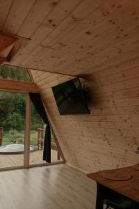 a room with a flat screen tv on the wall at Skala House in Skole