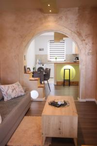 a living room with a couch and a table at Apartment Slađana i Luna in Subotica