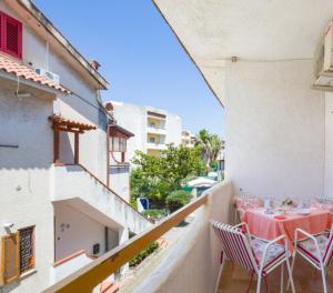 a balcony with a table and chairs on a building at La Casa di Teresa in Scalea +5 photos