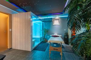 a room with a glass wall and a plant at Apartments Bracic Spa in Sukošan